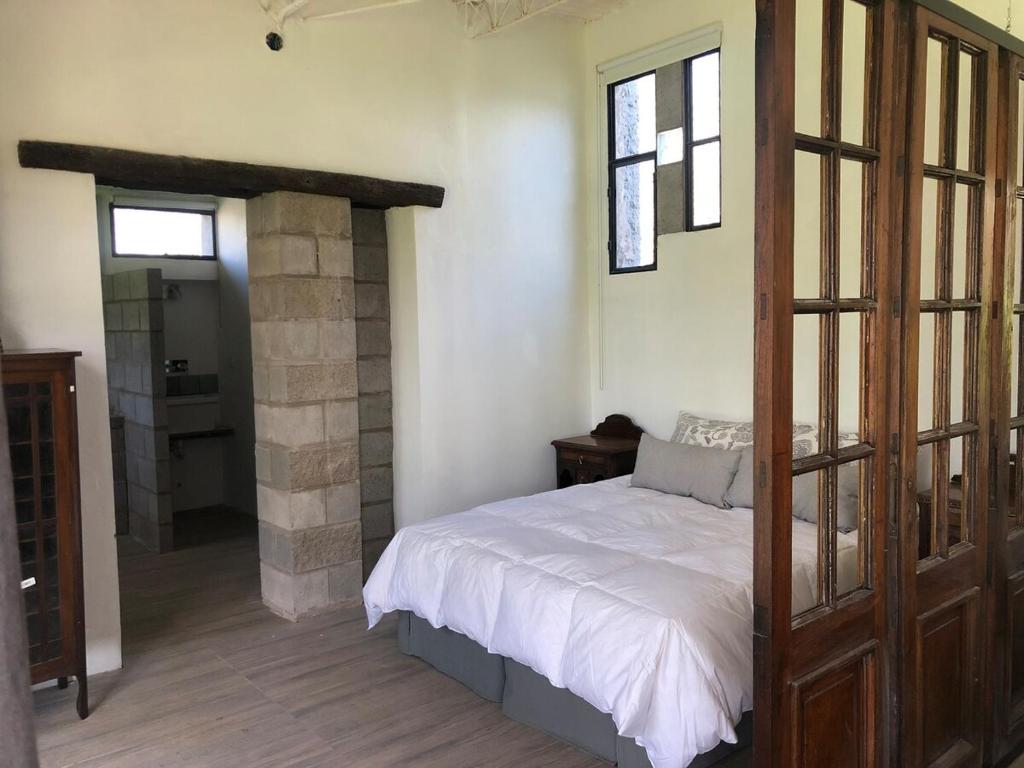 Postel nebo postele na pokoji v ubytování Los Deseos - Genuinamente Campo