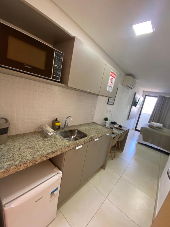 Kuchyň nebo kuchyňský kout v ubytování MANAÍRA APART HOTEL