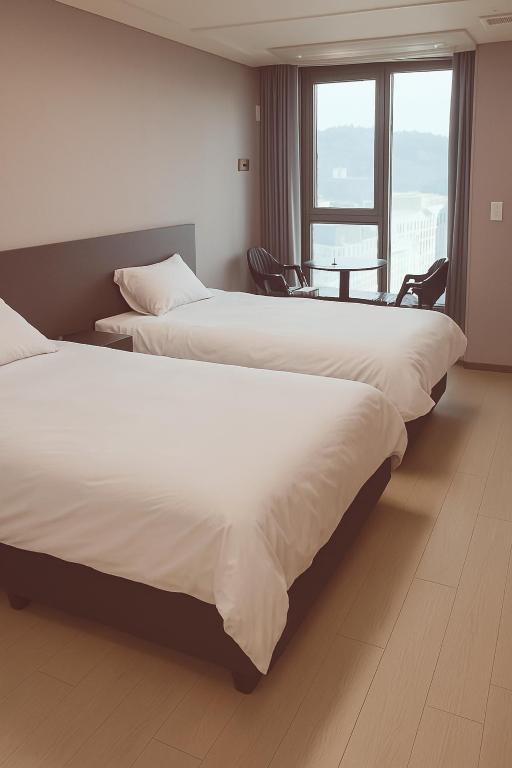 Postel nebo postele na pokoji v ubytování Someone Hotel