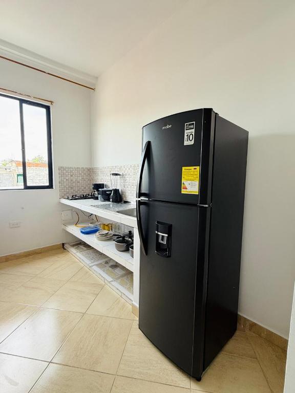 Kuchyň nebo kuchyňský kout v ubytování Alojamiento en Doradal - Apartaestudio central