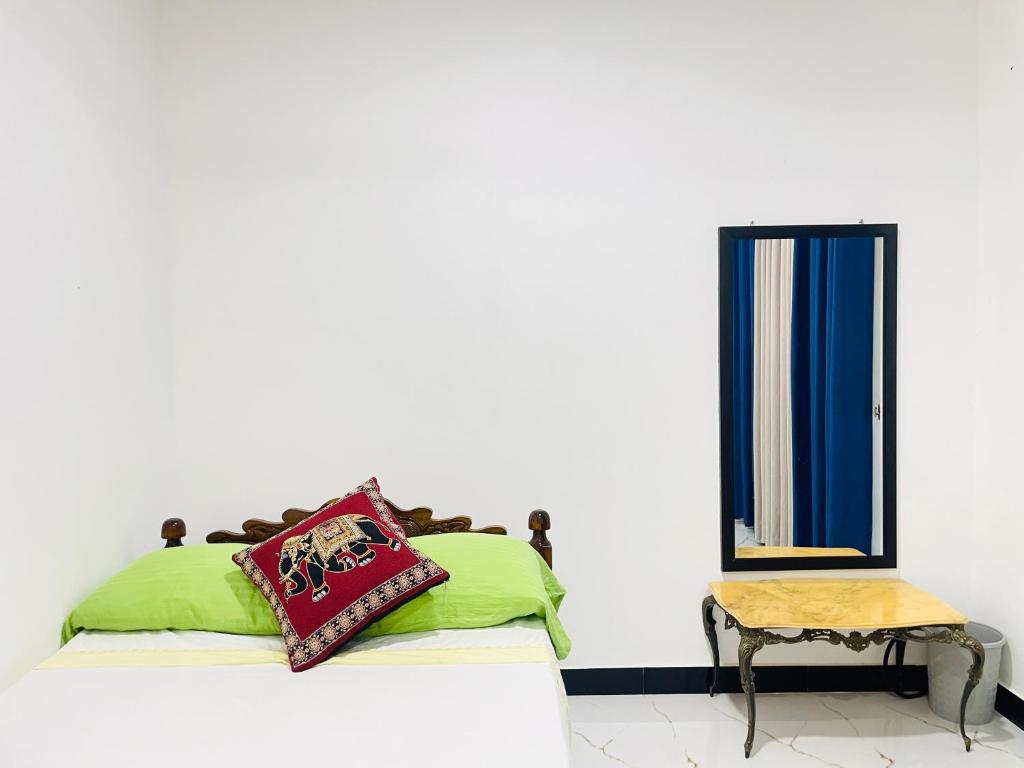 En eller flere senge i et værelse på Nature Villa