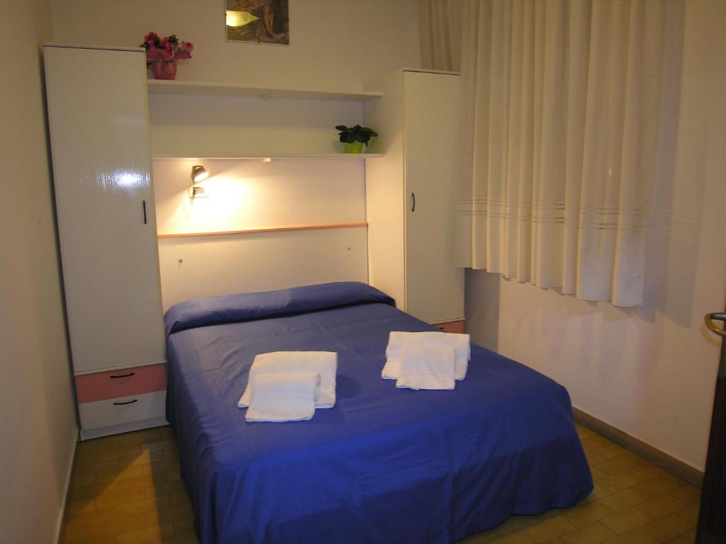 Postel nebo postele na pokoji v ubytování Hotel Garni Tahiti