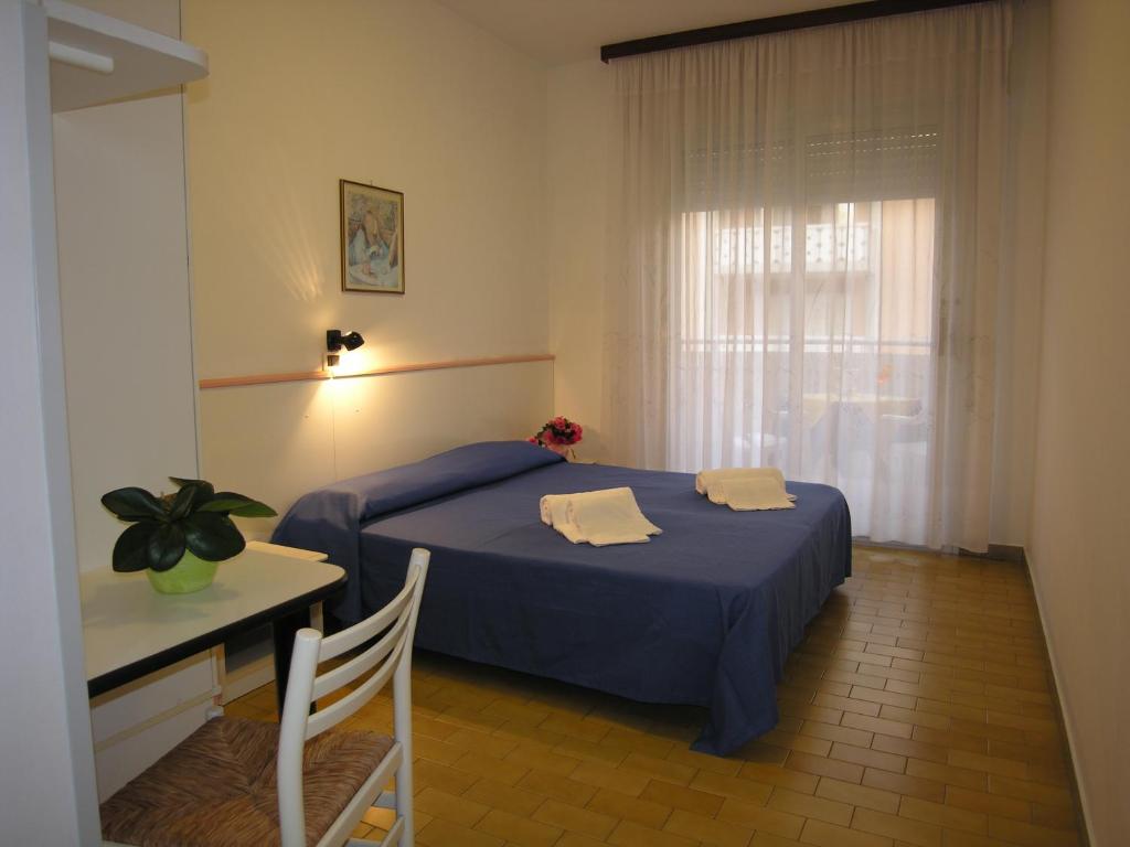 Postel nebo postele na pokoji v ubytování Hotel Garni Tahiti