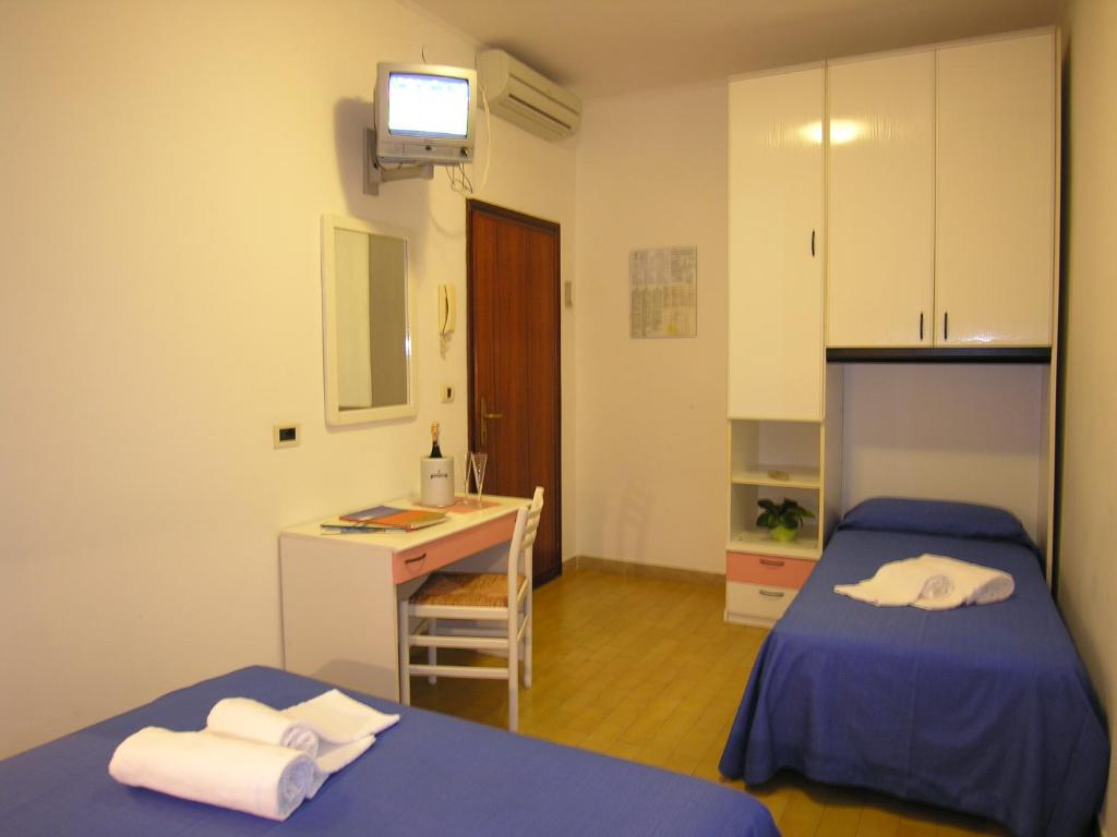 Postel nebo postele na pokoji v ubytování Hotel Garni Tahiti