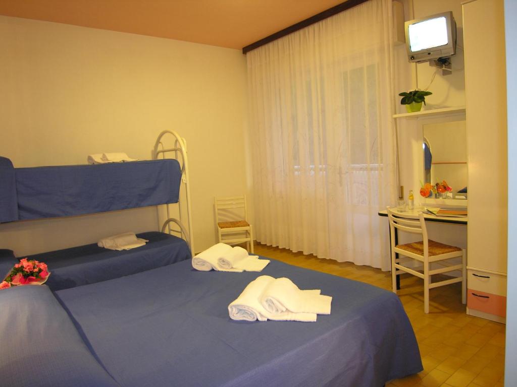 Postel nebo postele na pokoji v ubytování Hotel Garni Tahiti