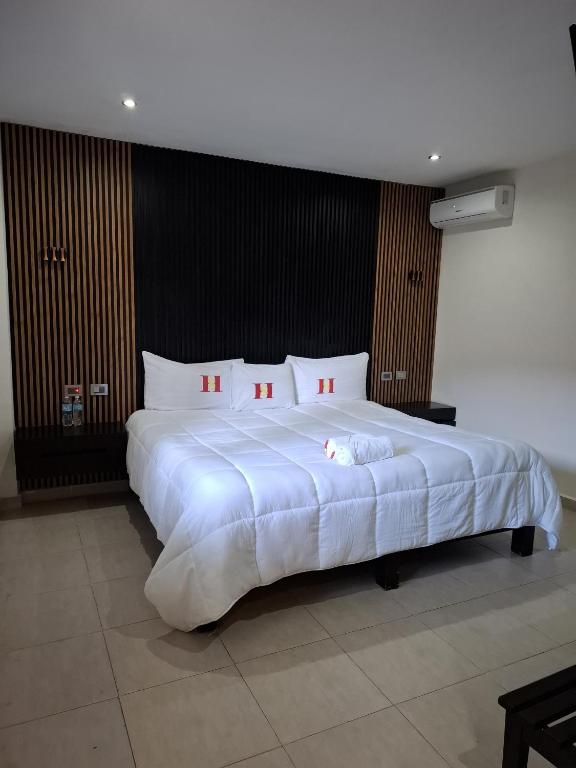 Postel nebo postele na pokoji v ubytování Hotel Sevilla Palenque