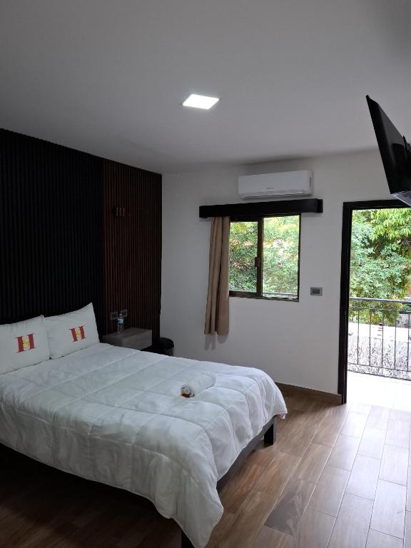 Postel nebo postele na pokoji v ubytování Hotel Sevilla Palenque