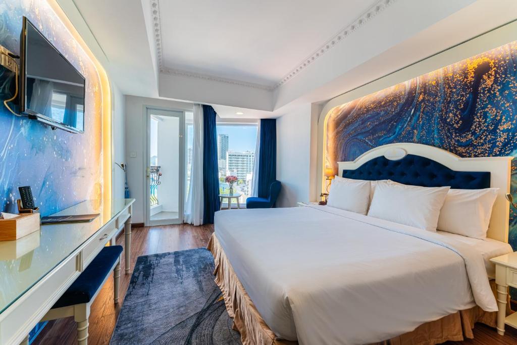 Giường trong phòng chung tại Nha Trang Prince Hotel