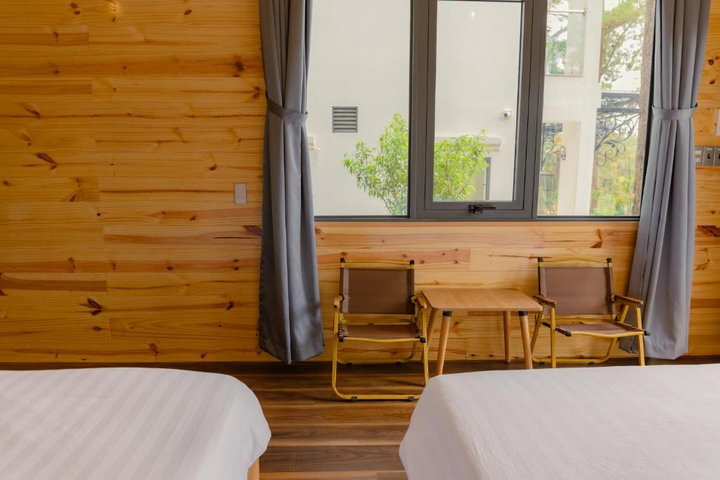 Postel nebo postele na pokoji v ubytování Gemstone Villa Măng Đen