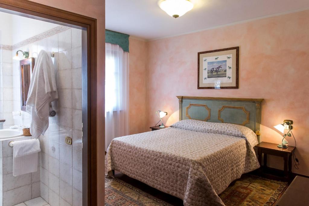 A bed or beds in a room at Agriturismo Le Anfore