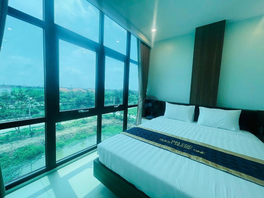 Postel nebo postele na pokoji v ubytování Tam Coc Guest House One & Hotel Ninh Binh