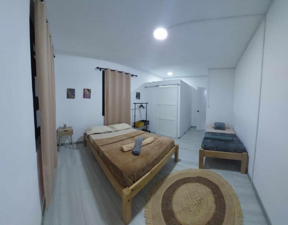 Postel nebo postele na pokoji v ubytování Location saisonnière Caza Villana