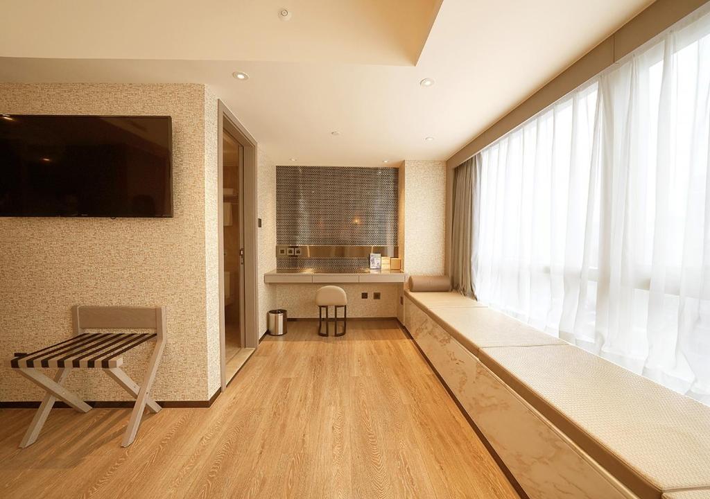 TV a/nebo společenská místnost v ubytování China Dragon Hotel