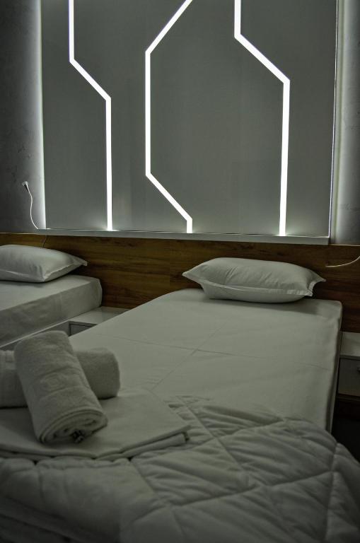 Postel nebo postele na pokoji v ubytování Apartments Good Night