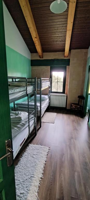 Postel nebo postele na pokoji v ubytování Alberguecasaflor