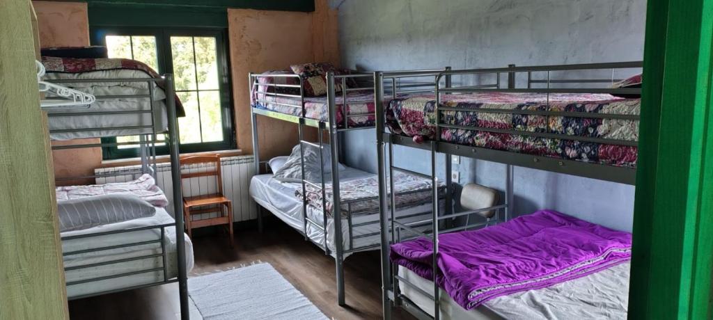 Postel nebo postele na pokoji v ubytování ALBERGUE peregrinos CASAFLOR