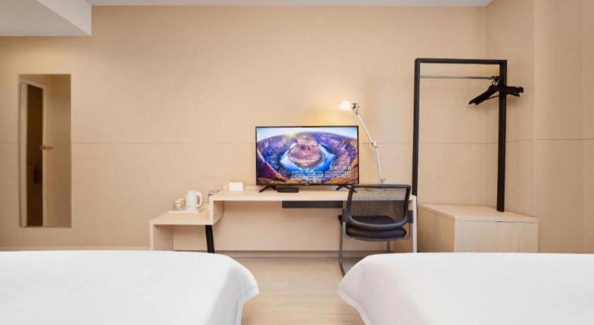 Postel nebo postele na pokoji v ubytování JinJiang Inn Datong Pingchengqiao