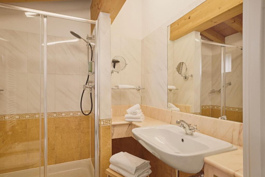 Een badkamer bij Hotel Le Mura