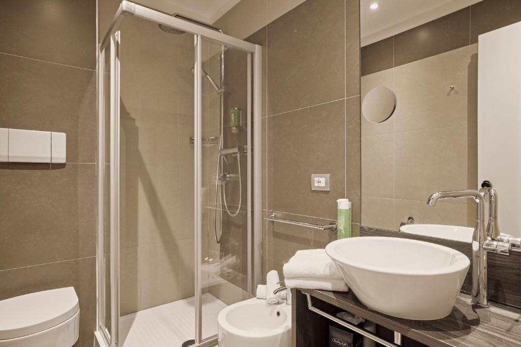 Een badkamer bij Hotel Le Mura