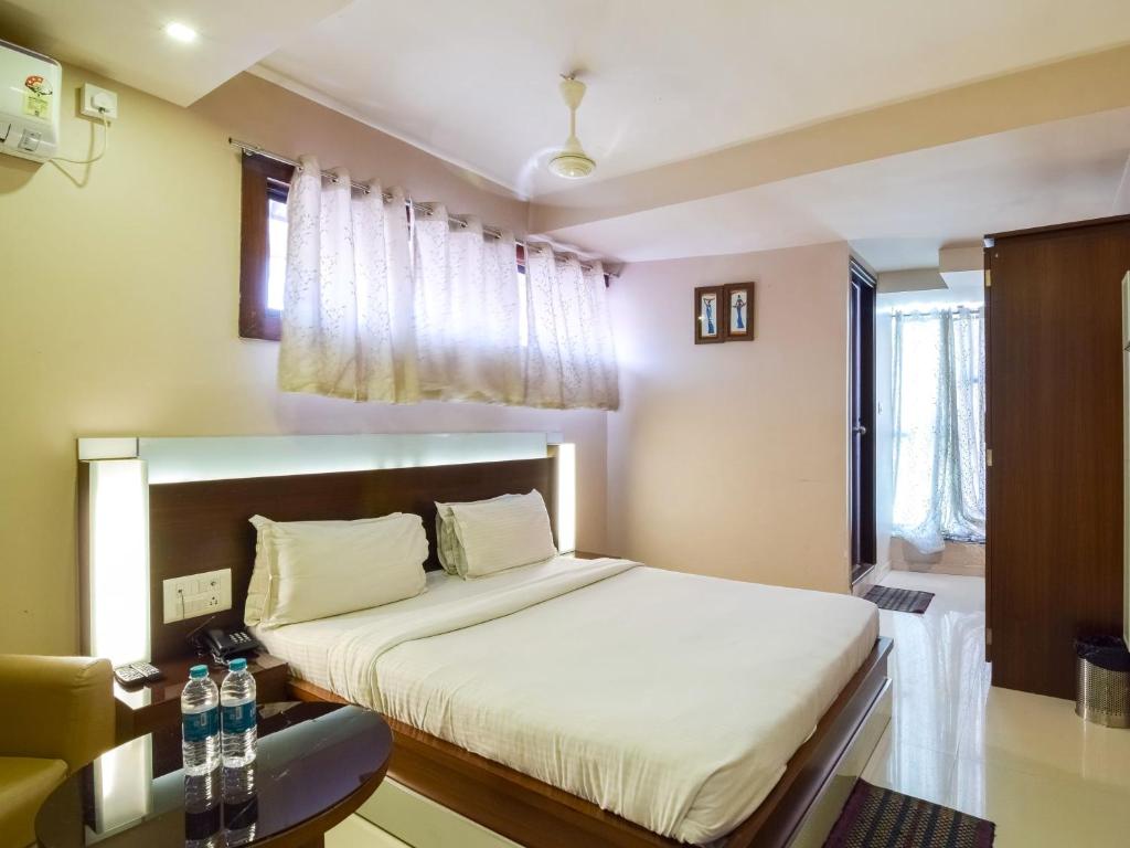 Postel nebo postele na pokoji v ubytování Hotel D Tark Plaza
