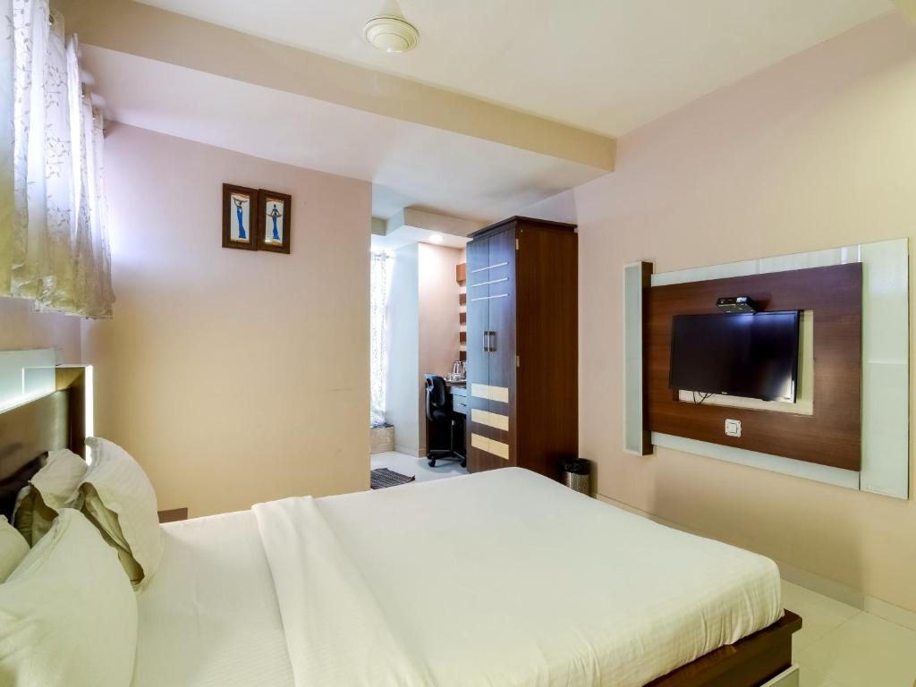 Postel nebo postele na pokoji v ubytování Hotel D Tark Plaza