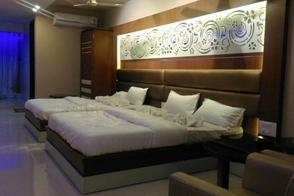 Postel nebo postele na pokoji v ubytování Hotel D Tark Plaza