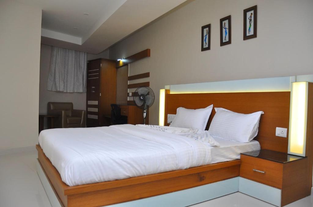 Postel nebo postele na pokoji v ubytování Hotel D Tark Plaza