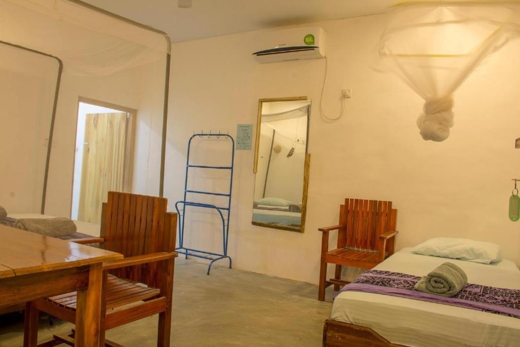 Postel nebo postele na pokoji v ubytování Aira Bay Resort Arugambay