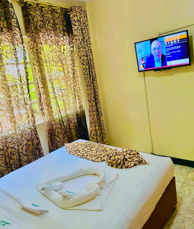 Postel nebo postele na pokoji v ubytování Hotel Embassy
