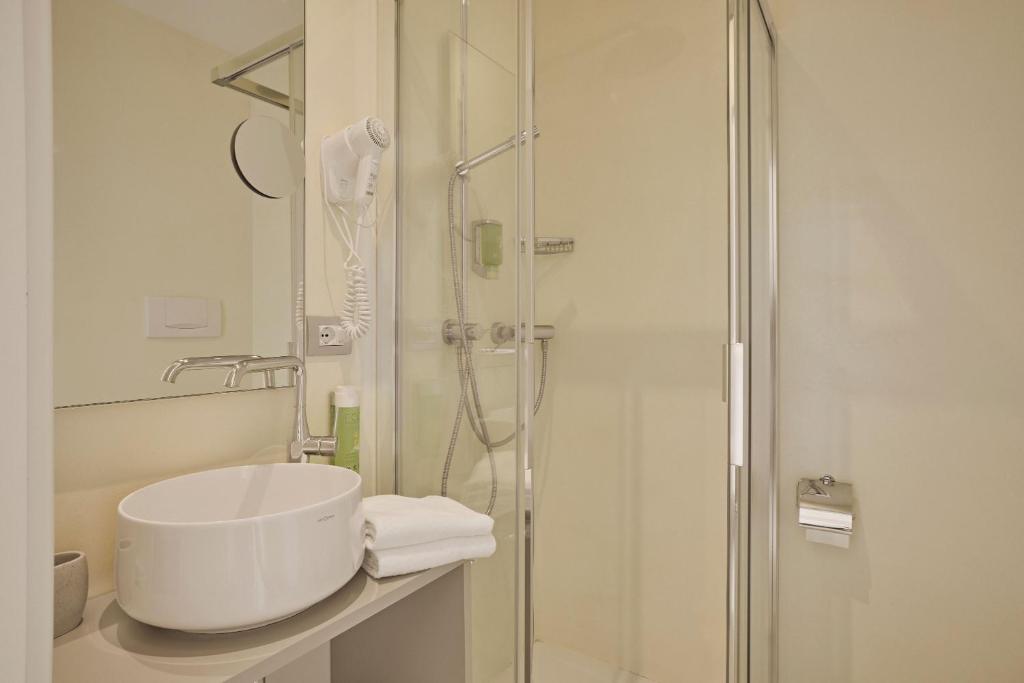 Een badkamer bij Hotel Le Mura
