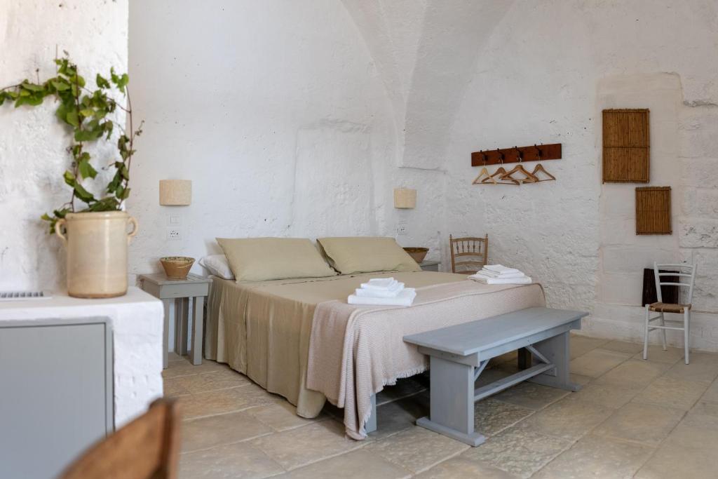 Letto o letti in una camera di Masseria Specula