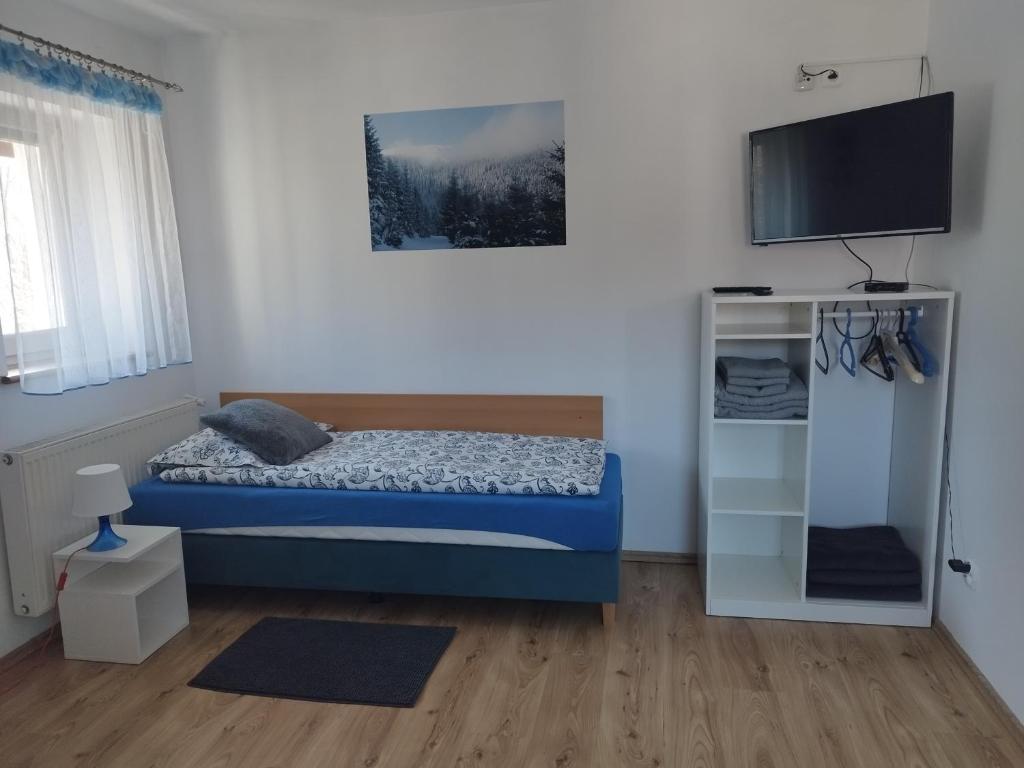 Posteľ alebo postele v izbe v ubytovaní Jaskółka