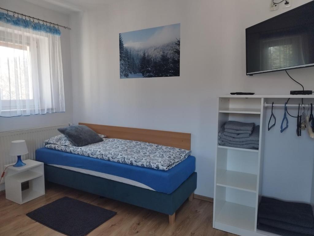 Posteľ alebo postele v izbe v ubytovaní Jaskółka