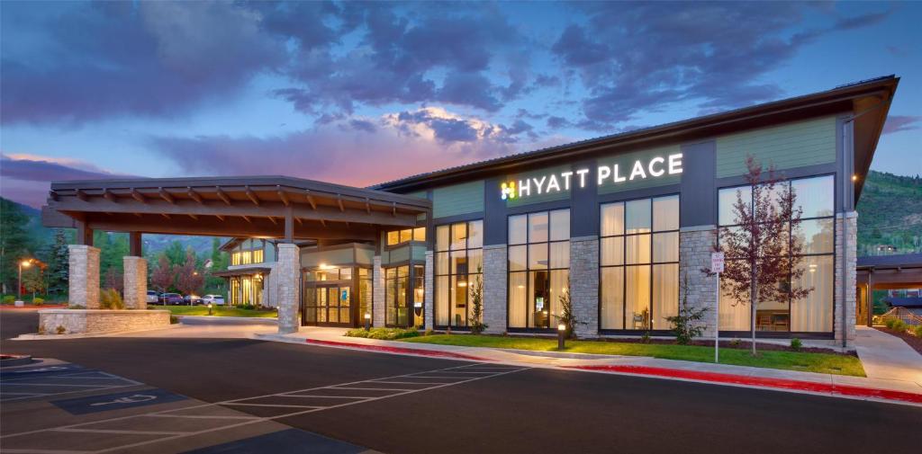 a large building with a knight place sign on it at Hyatt Place Park City in Park City