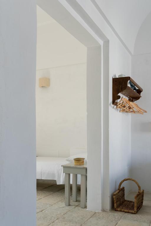 Letto o letti in una camera di Masseria Specula