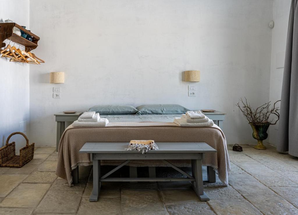 Letto o letti in una camera di Masseria Specula