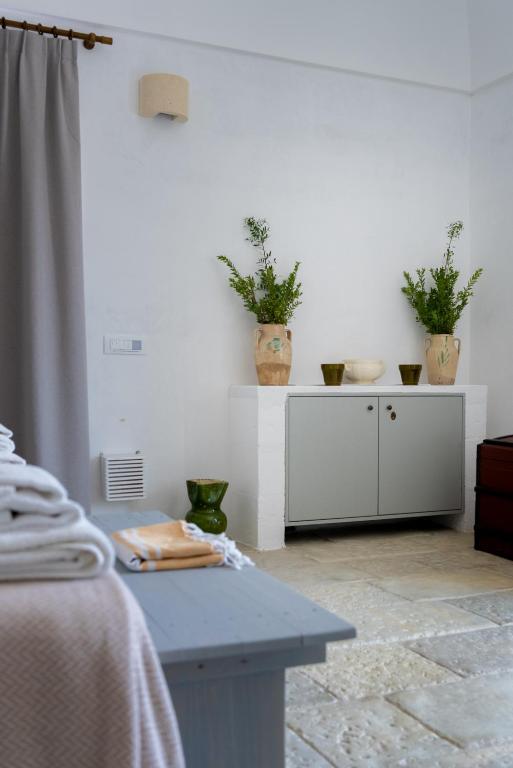 Letto o letti in una camera di Masseria Specula