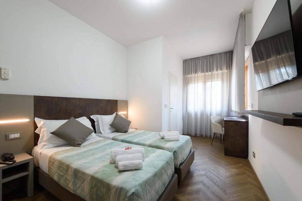 Postel nebo postele na pokoji v ubytování Hotel Casa Tra Noi
