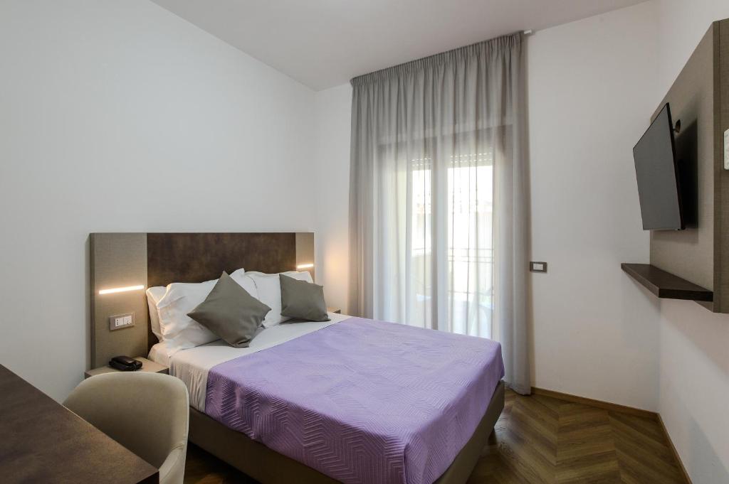 Postel nebo postele na pokoji v ubytování Hotel Casa Tra Noi