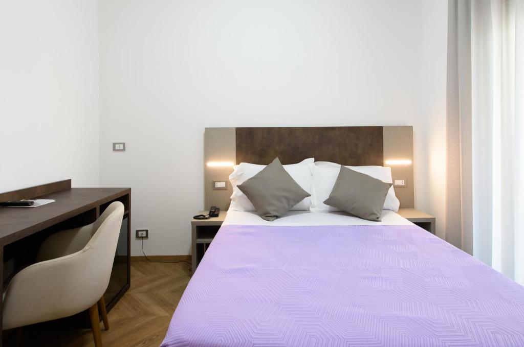 Postel nebo postele na pokoji v ubytování Hotel Casa Tra Noi