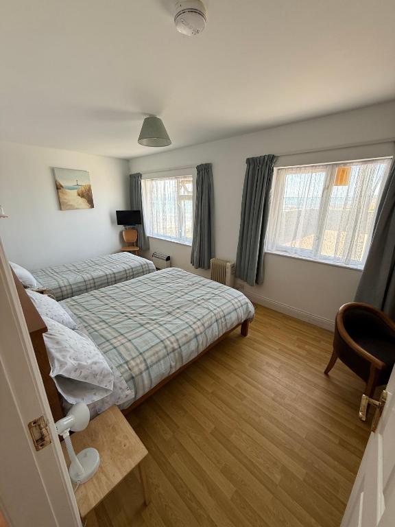 Postel nebo postele na pokoji v ubytování ONeills Apartments