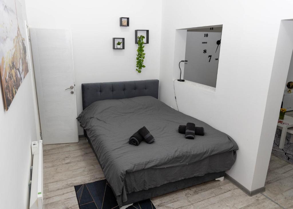 Postel nebo postele na pokoji v ubytování El Mundo Apartman