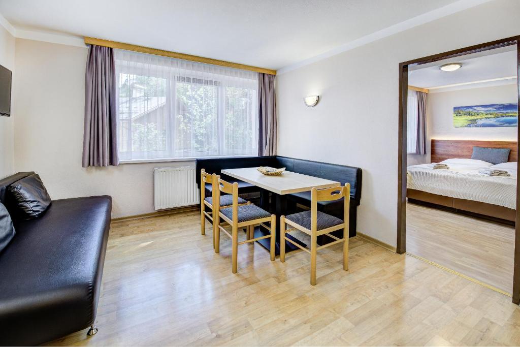 Posteľ alebo postele v izbe v ubytovaní Appartement Alpensee