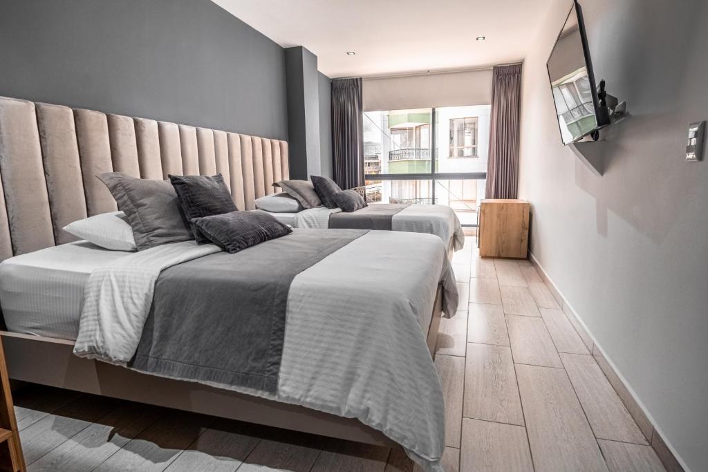 Postel nebo postele na pokoji v ubytování Hotel Plaza Doce
