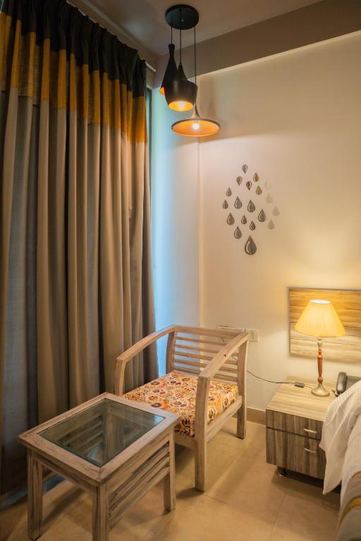 Postel nebo postele na pokoji v ubytování Ahuja Residency Parklane