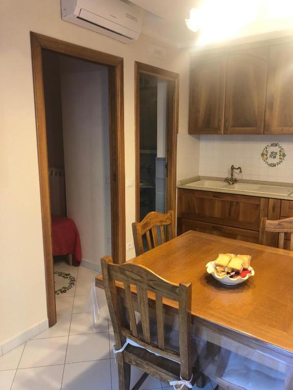 a kitchen with a table with a bowl of food on it at Positano Casa Elisa in Positano