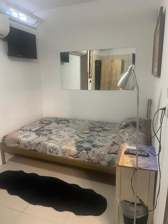 A bed or beds in a room at Centrally Located Private Rooms