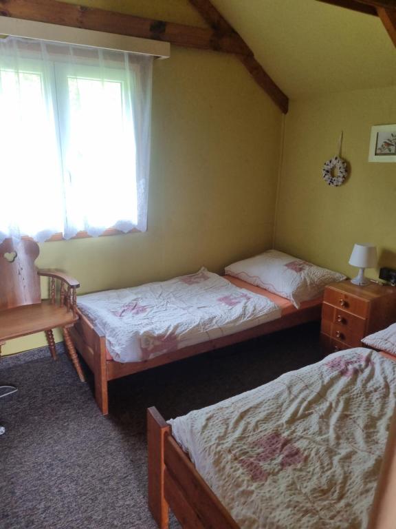 Postel nebo postele na pokoji v ubytování Chatky a apartmány Apollo na Vysočině