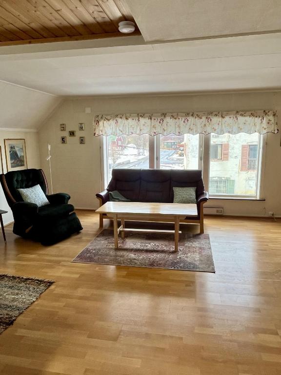 a living room with a couch and a coffee table at Budget apartment in Gravdal in Gravdal