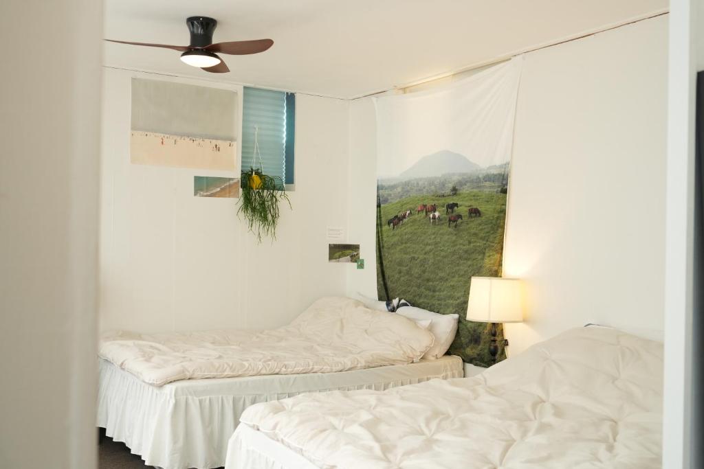 Ένα ή περισσότερα κρεβάτια σε δωμάτιο στο Atelier Vert